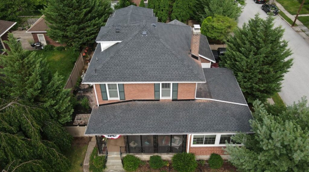 aerial view of a house with a newly installed shingle roof